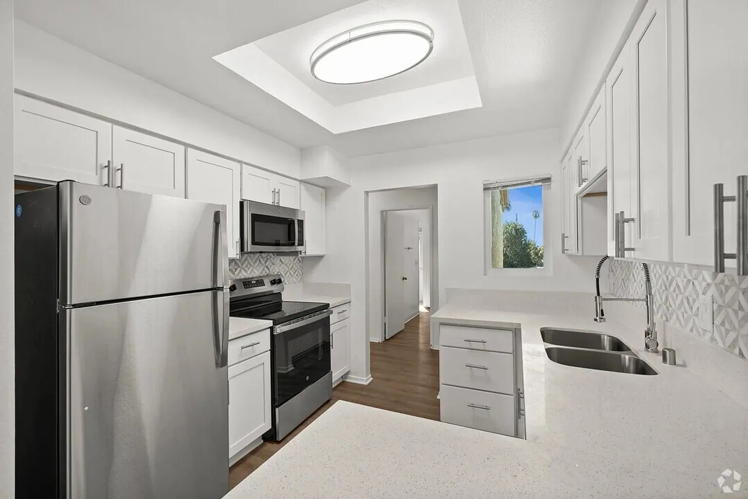 Ashwood Gardens Apartments modern kitchen stainless steel appliances white cabinets