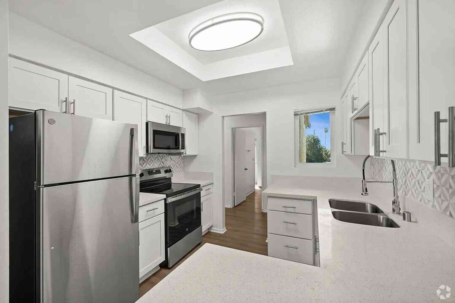 modern kitchen stainless steel appliances white cabinets