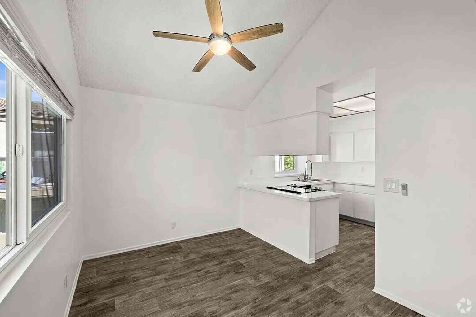dining area vaulted ceilings wood style flooring