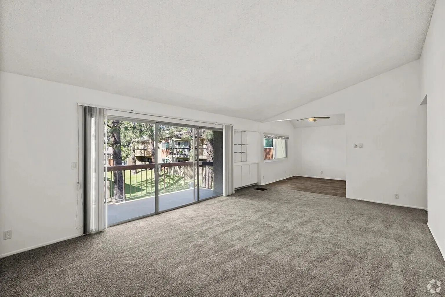 Ashwood Gardens Apartments spacious living room sliding glass door balcony