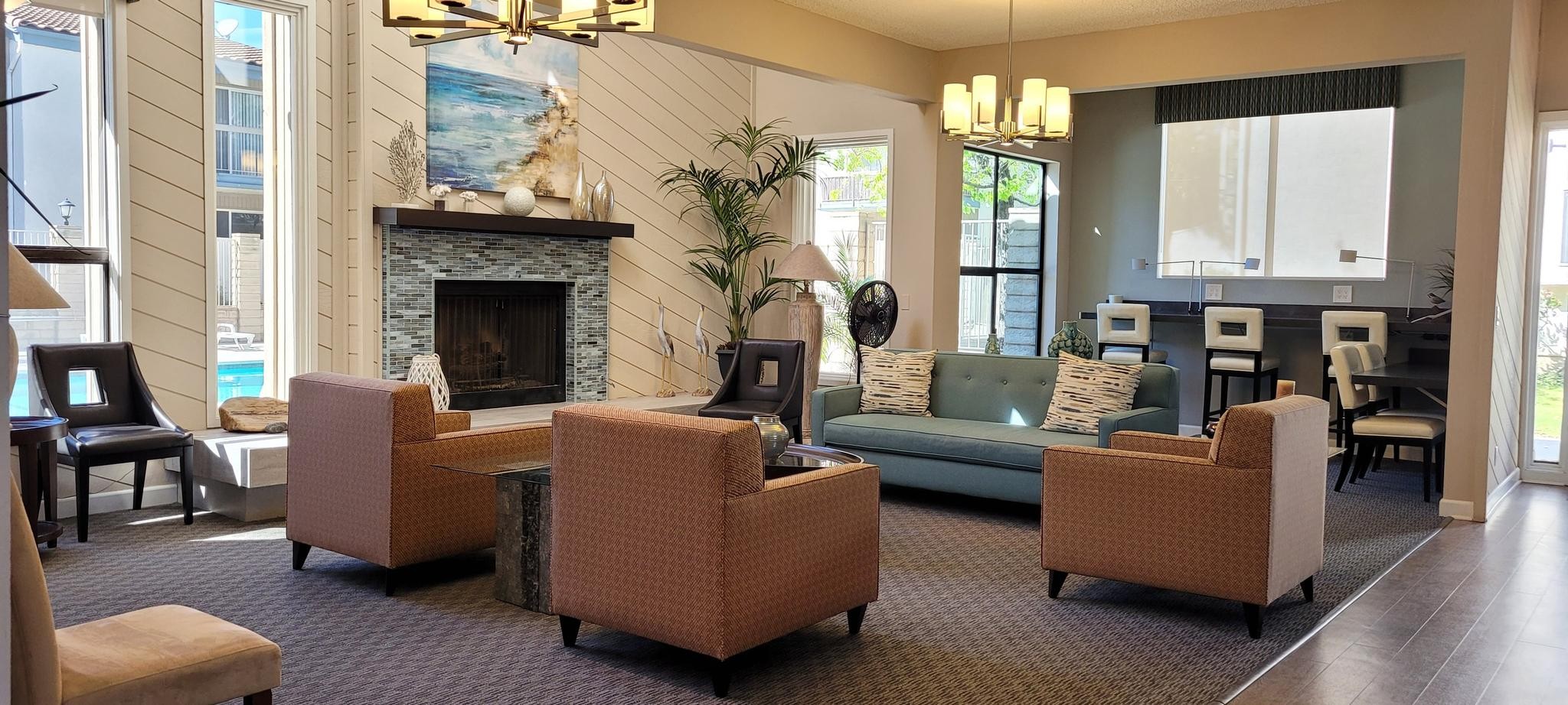 Ashwood Gardens community clubhouse with fireplace and seating